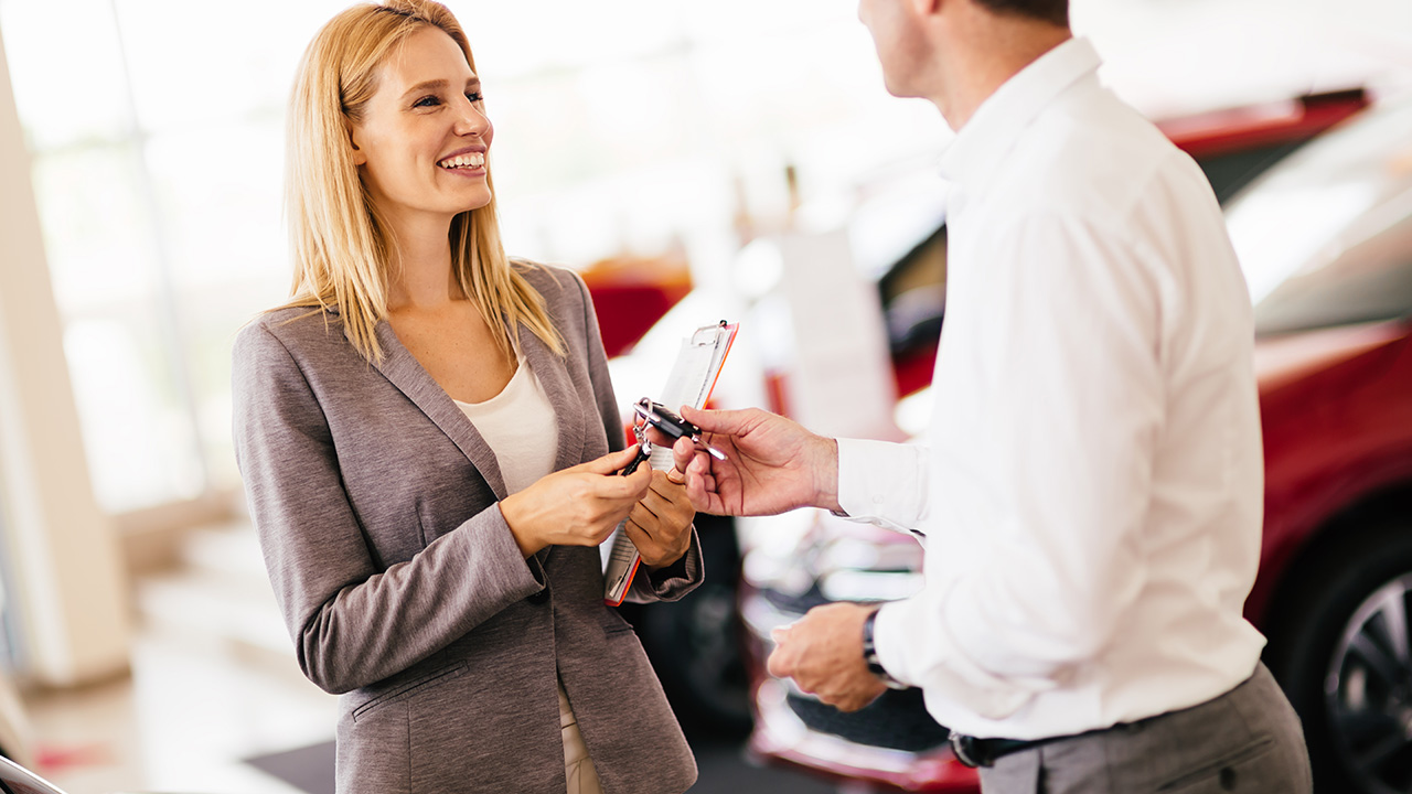 Customer buying a car at dealership