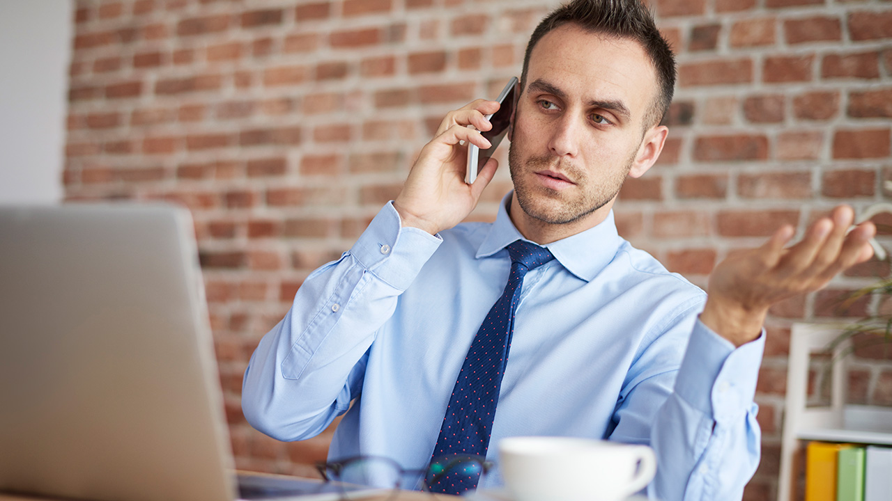 Young entrepreneur having a difficult conversation with a client