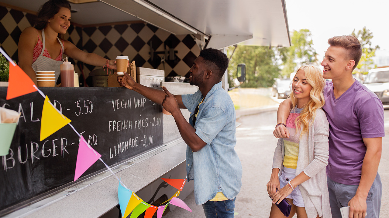 Happy customers in line at food truck