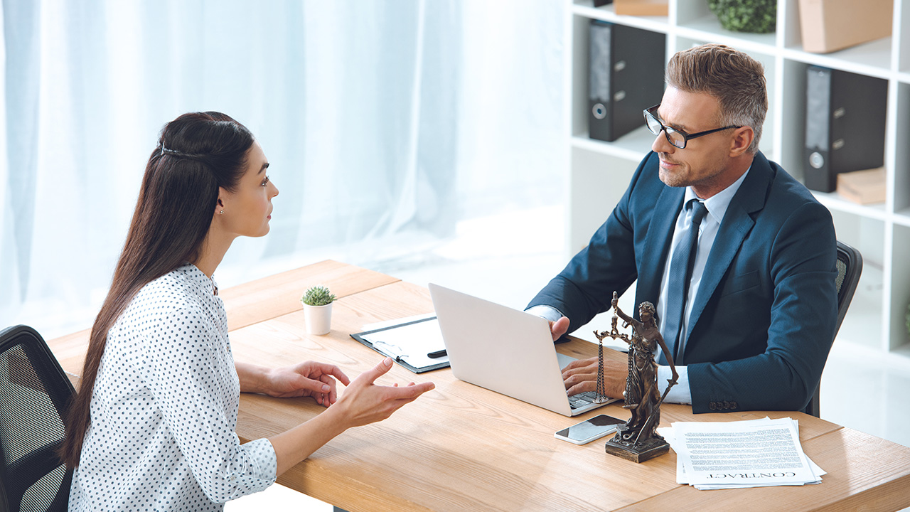 Lawyer working with client in office