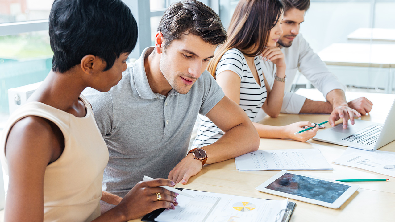 Business team creating action plan in office