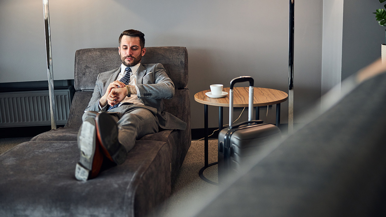 Punctual business man checking his watch