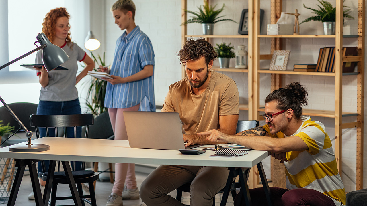 Young coworkers working together on new project in the office