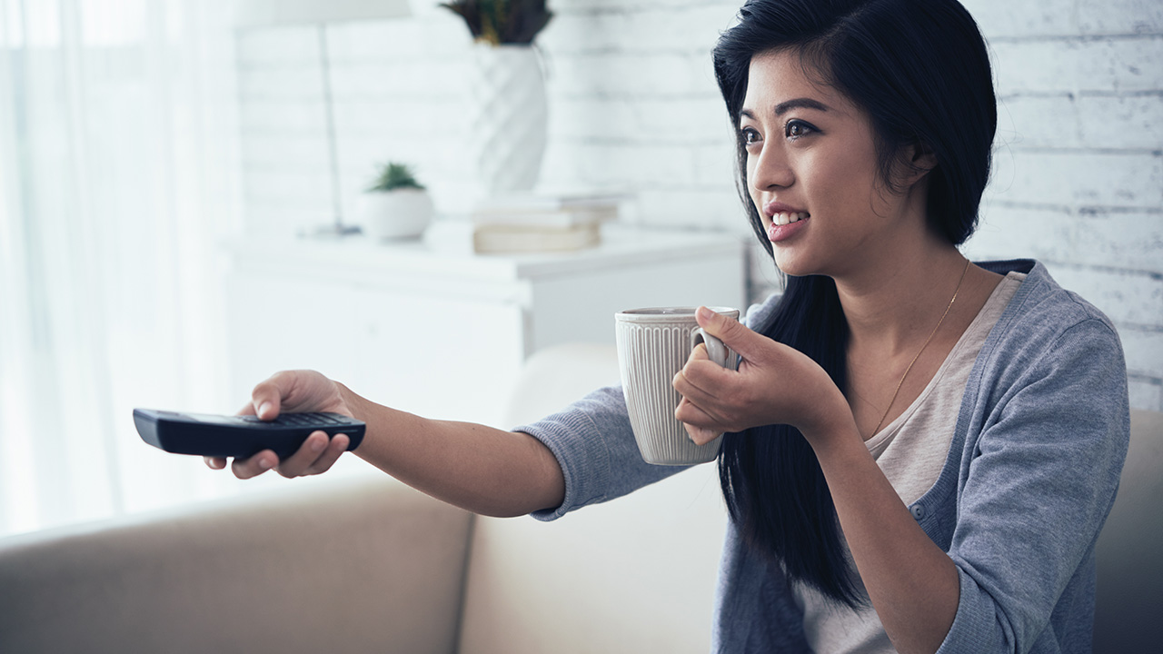 Woman entrepreneur watching TV