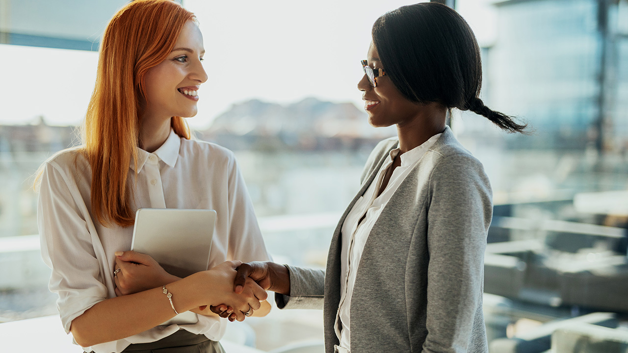 Two businesswomen meeting for the first time