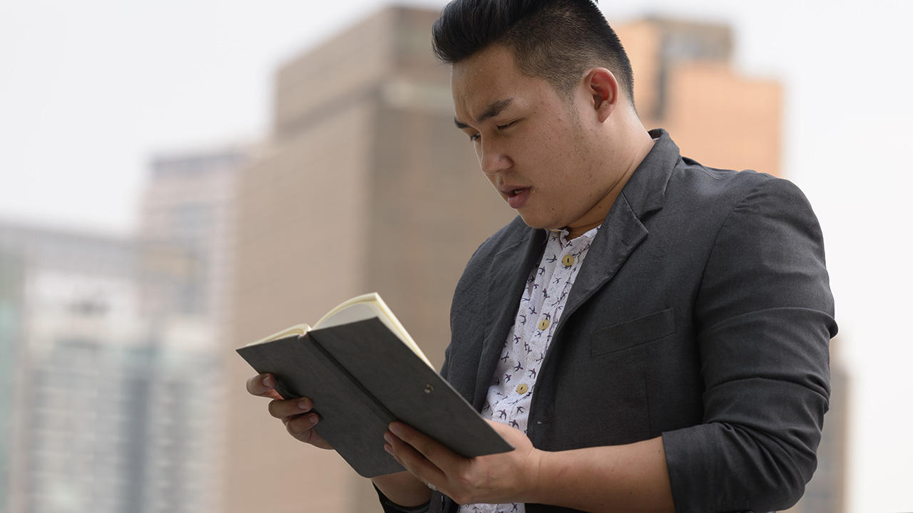 Entrepreneur reading book in the city