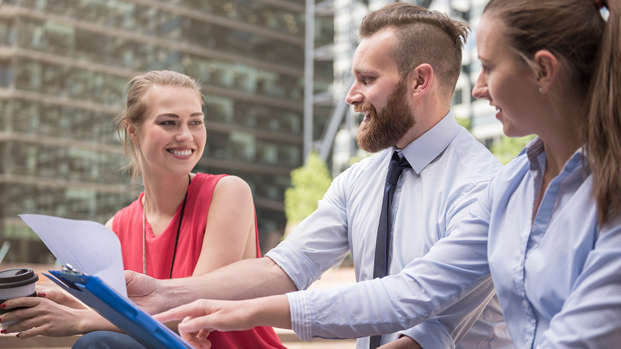 Smiling Business Colleagues Working Together