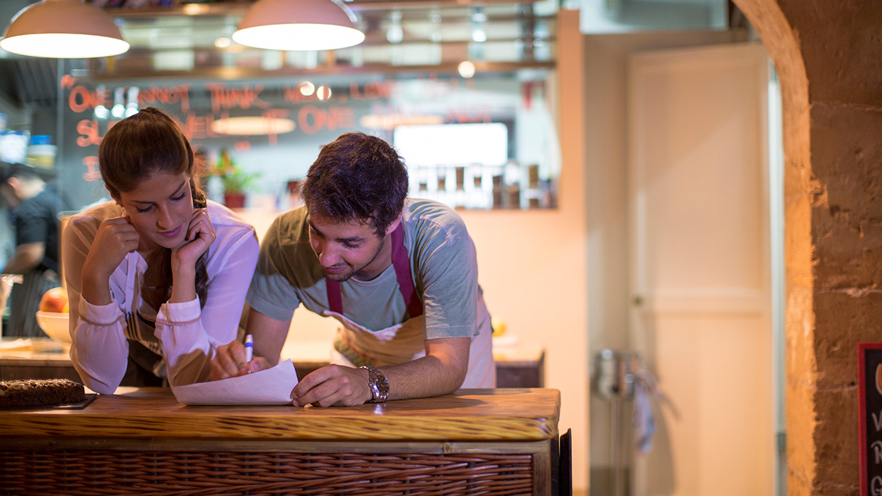 Restaurant Owners Working in Kitchen