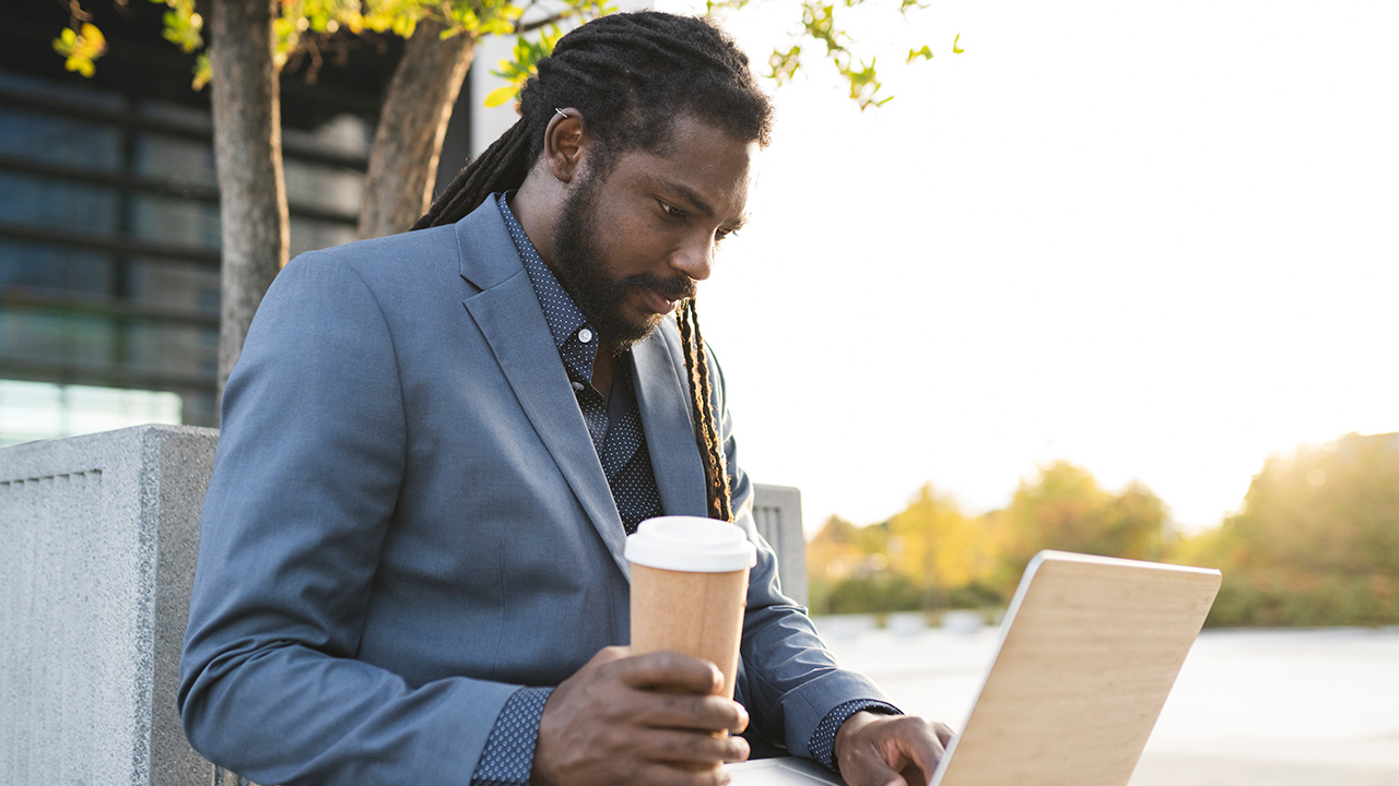 Business Man with Laptop and Coffee