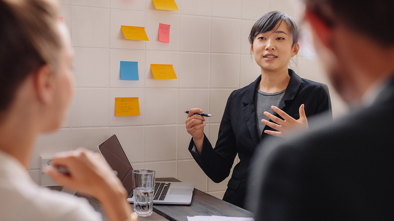 Young Female Executive Giving a Presentation