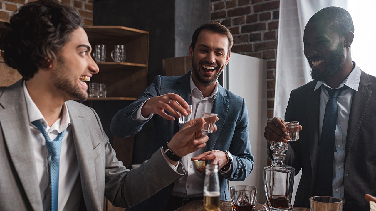 Smiling Businessmen Drinking Mezcal