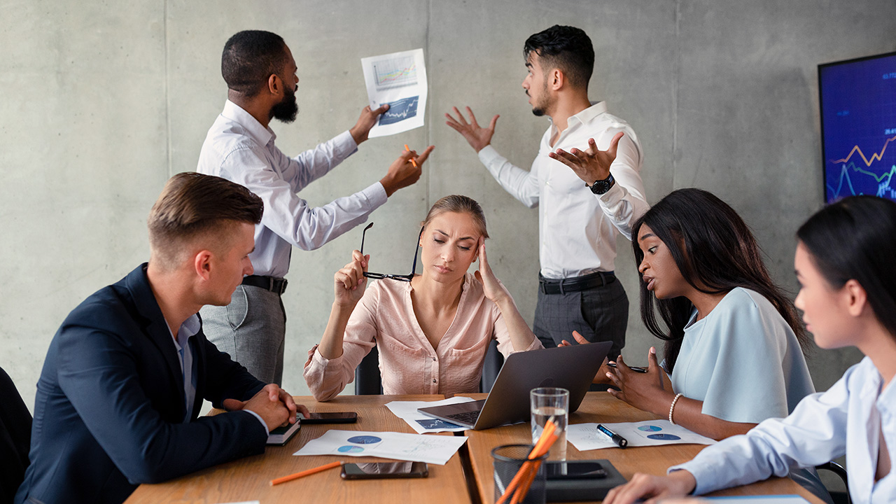 People in Conflict at a Business Meeting