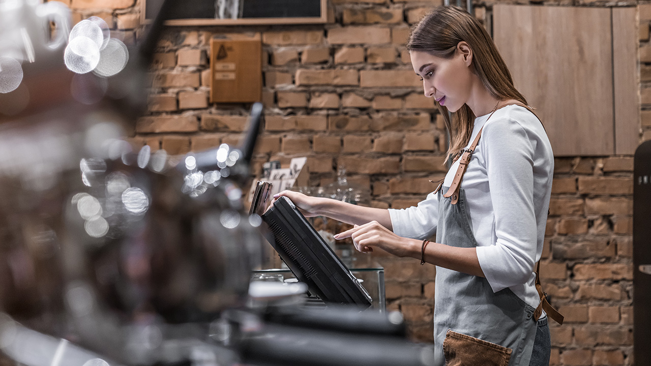 Young Woman Working in a Coffee Shop