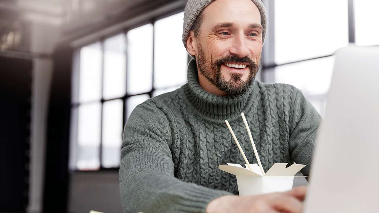 Email Marketing Manager Checks Email on Laptop