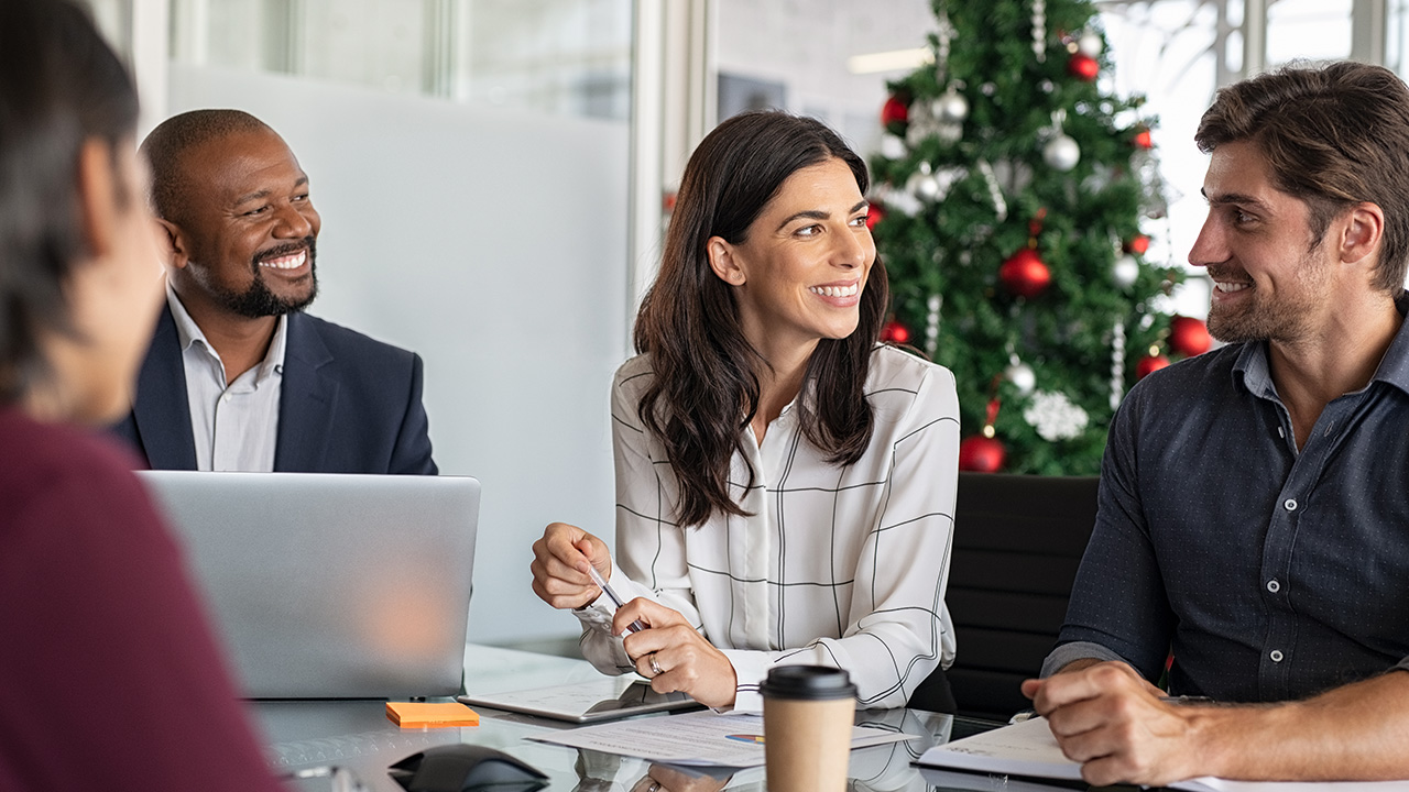 Business Meeting with Christmas Tree in Background