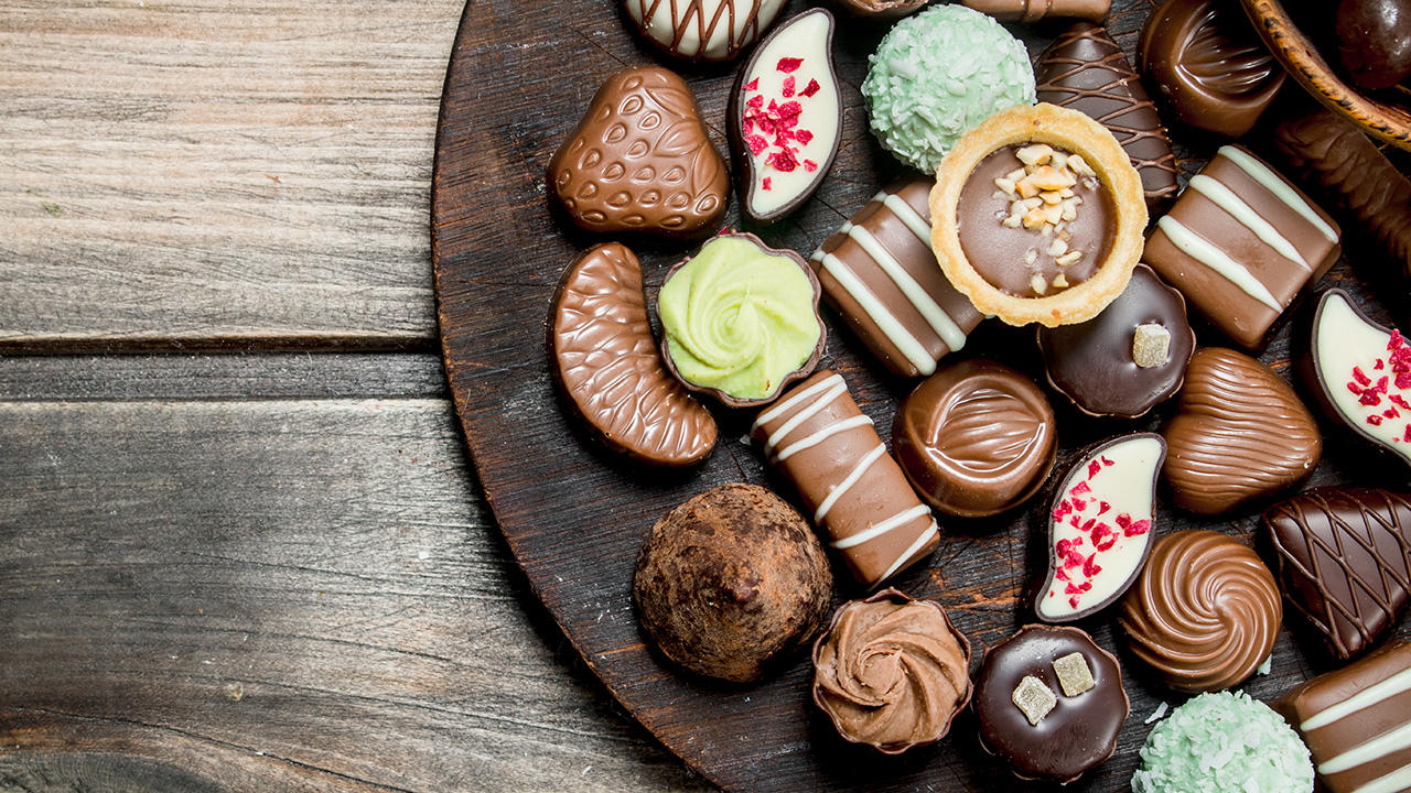 Chocolate Sweets on a Wooden Board