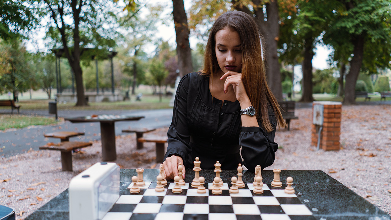 Young Woman Playing Chess