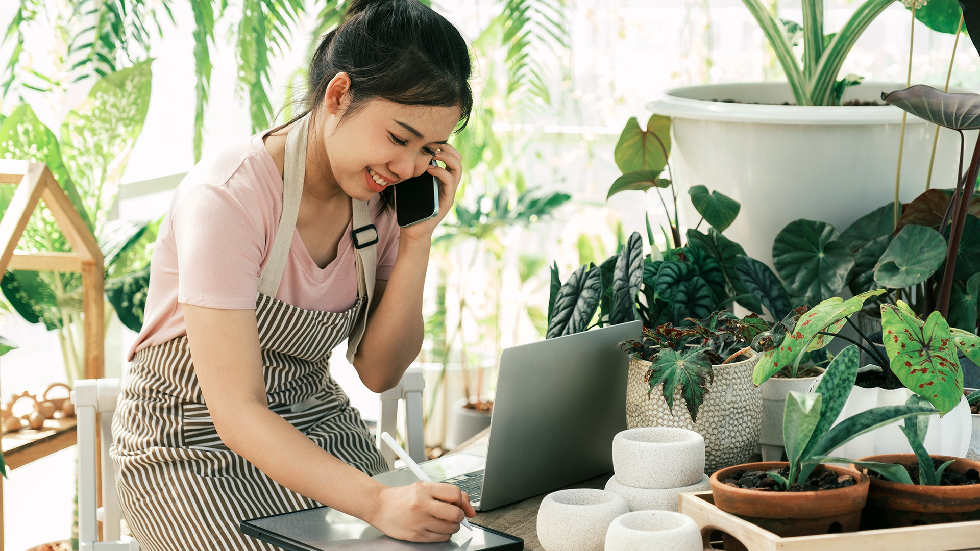 Young Woman Florist Contacting Happy Customers