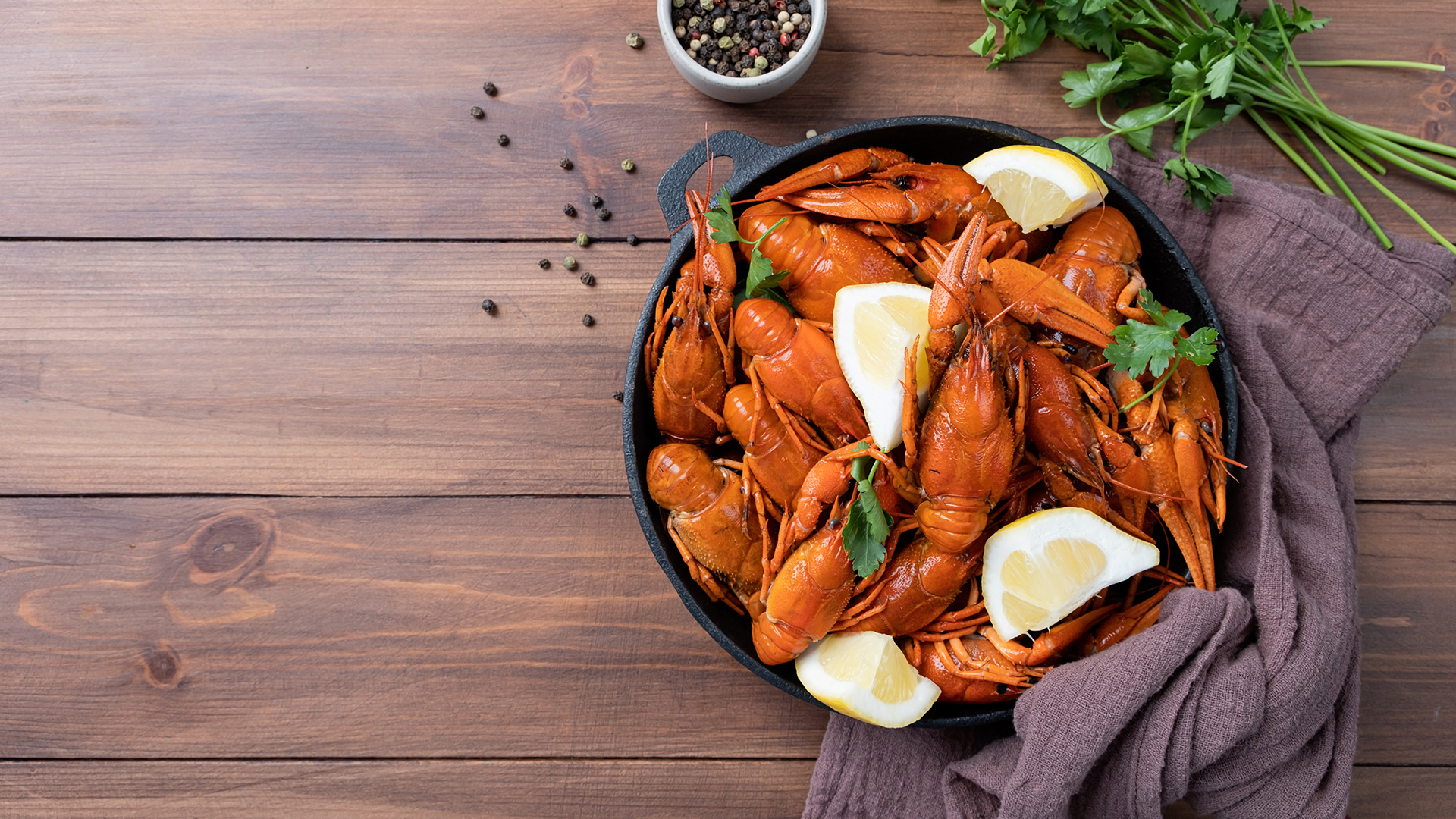 Cooked Crawfish in Saucepan with Lemons and Spices