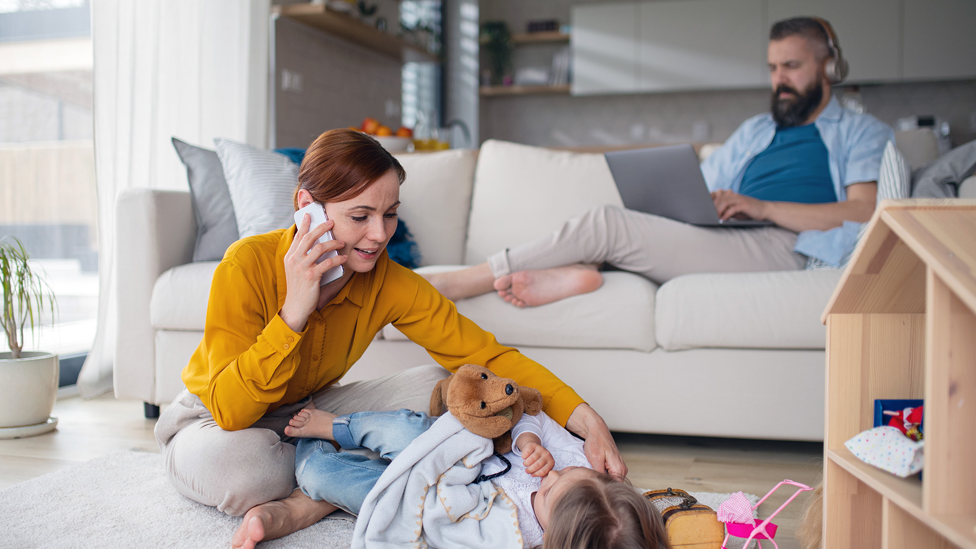 Business Owner Mom Playing with Daughter While Working from Home